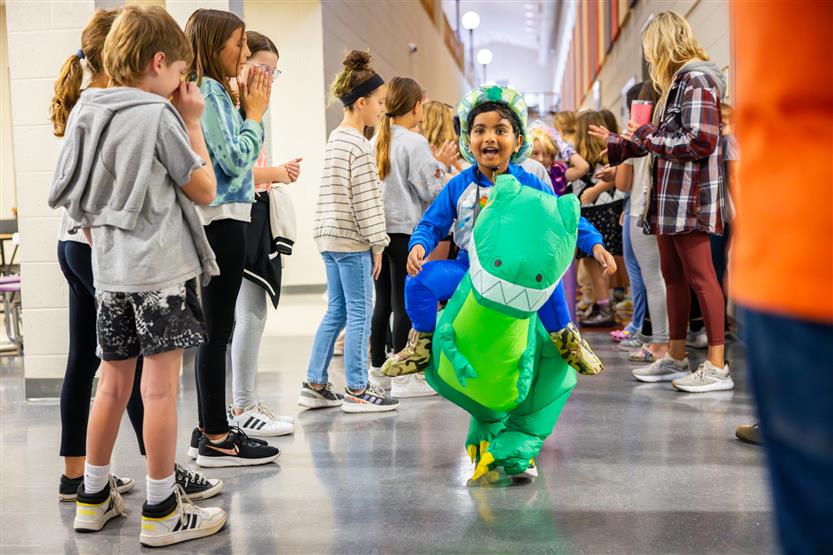 Students participate in an alphabet parade
